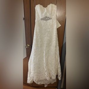 Wedding dress for sale. Includes veil and crown.